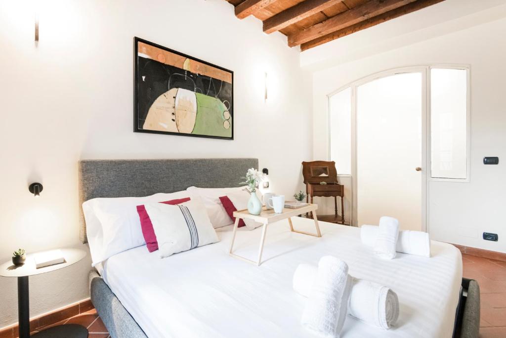 Posteľ alebo postele v izbe v ubytovaní Prestigioso appartamento Piazza Duomo by Easylife