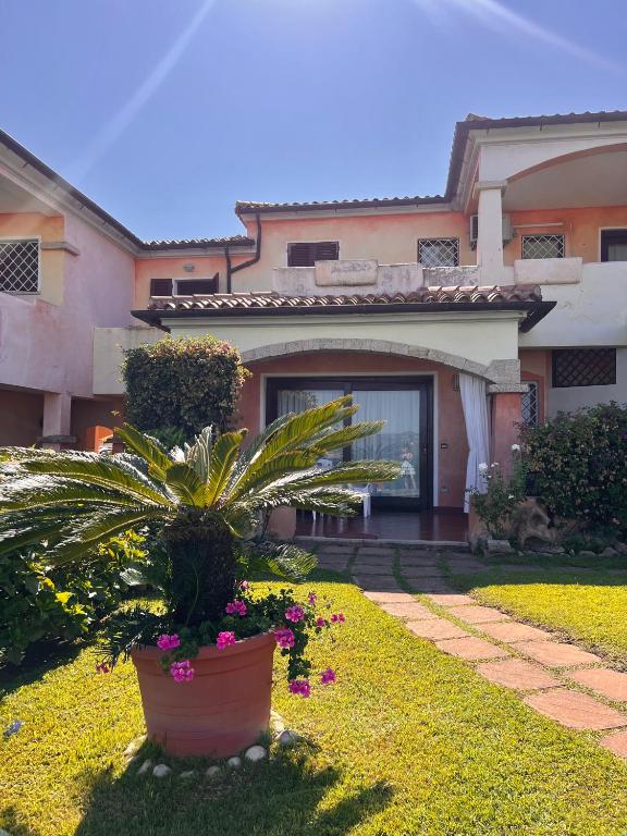 a house with a potted plant in front of it at Casa Terrazza sul Golfo in Cannigione