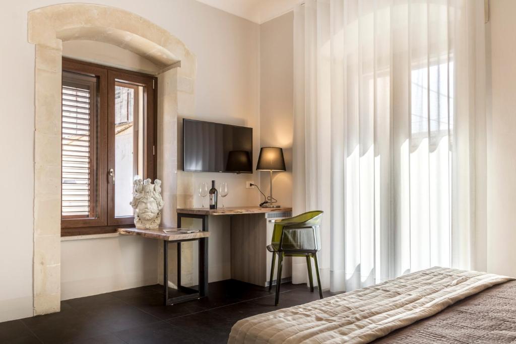 Postel nebo postele na pokoji v ubytování B&B Vicere Speciale