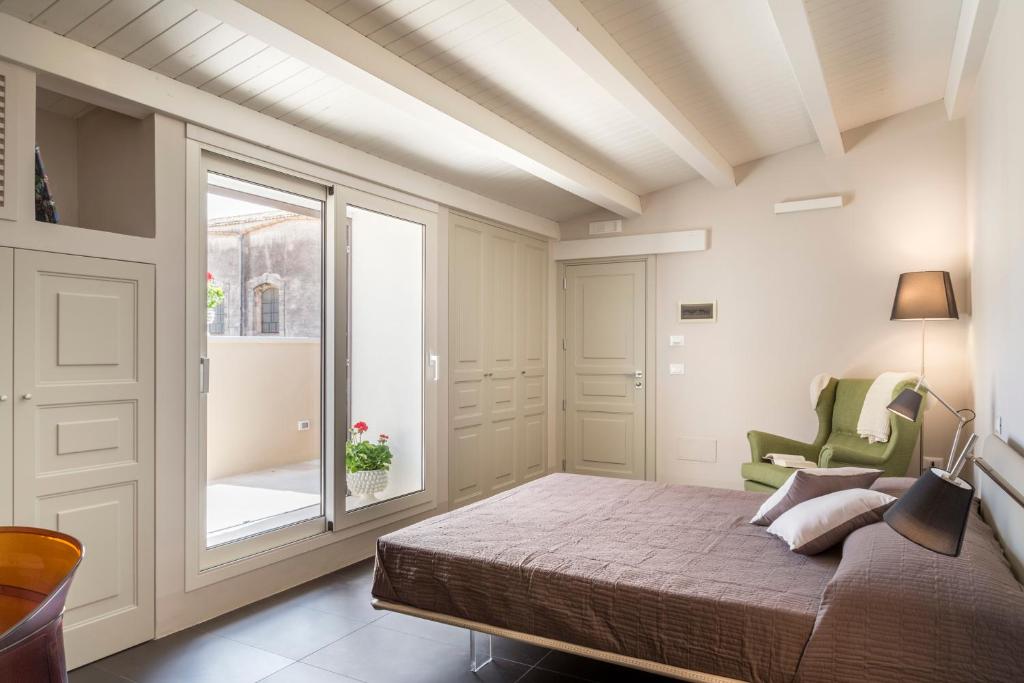 Postel nebo postele na pokoji v ubytování B&B Vicere Speciale