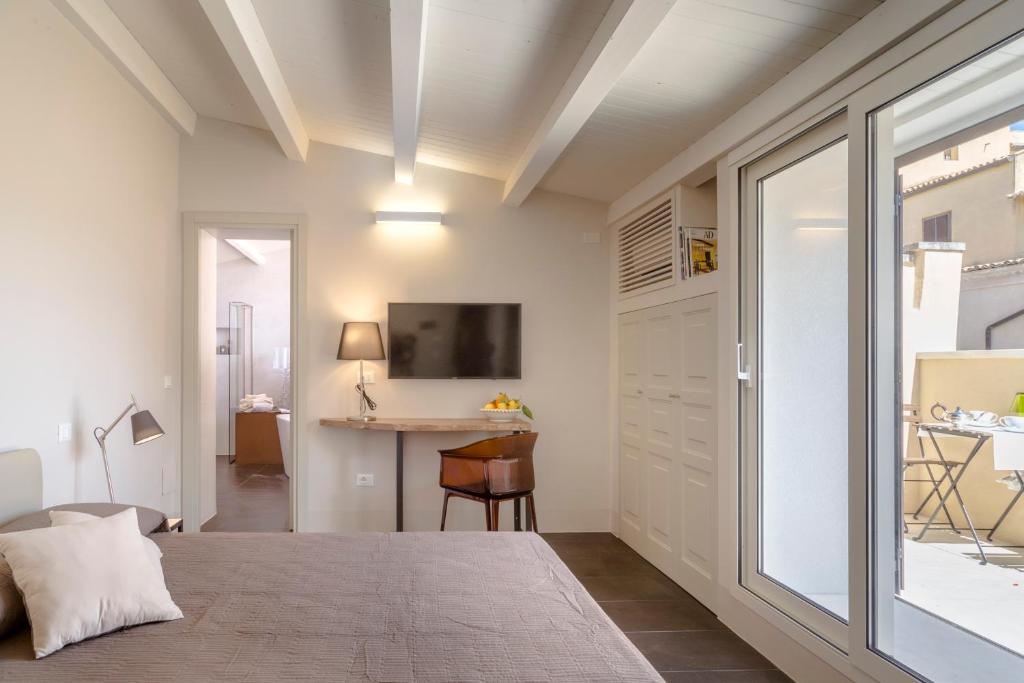 Postel nebo postele na pokoji v ubytování B&B Vicere Speciale