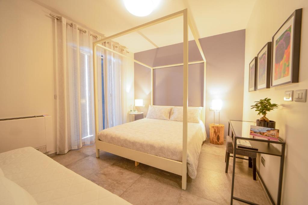 Postel nebo postele na pokoji v ubytování Cascina Belmonte