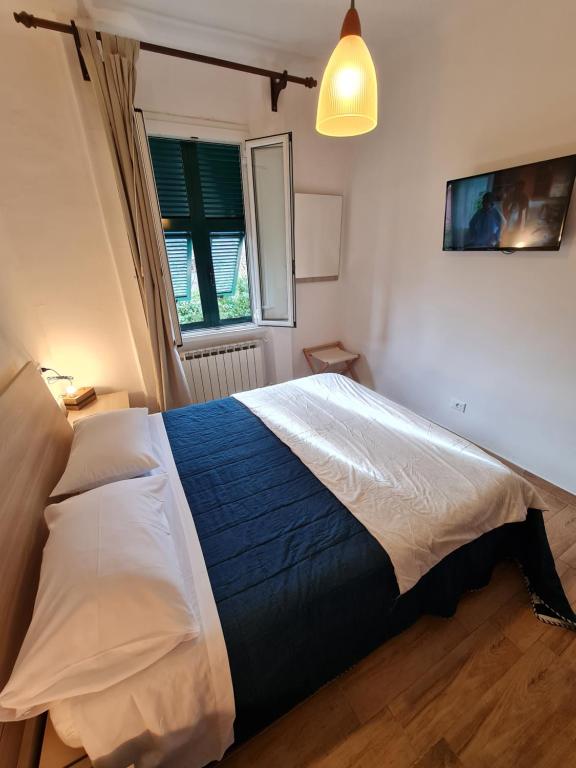 Postel nebo postele na pokoji v ubytování Albergo Genio