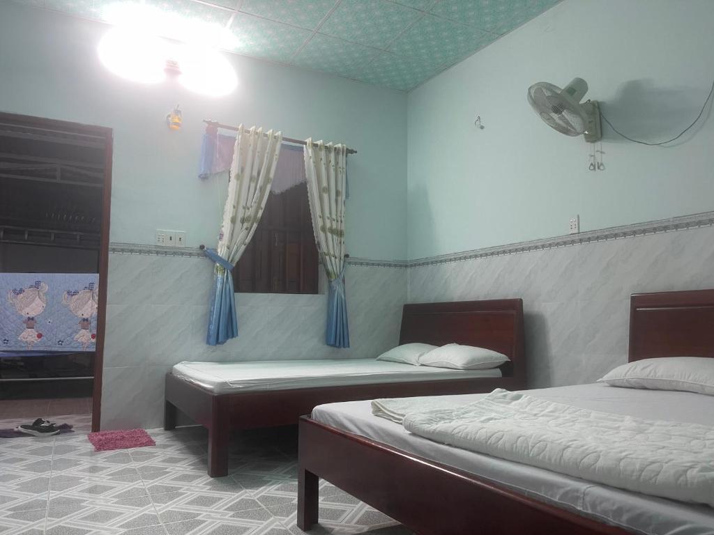 Postel nebo postele na pokoji v ubytování Hotel Gia Hân