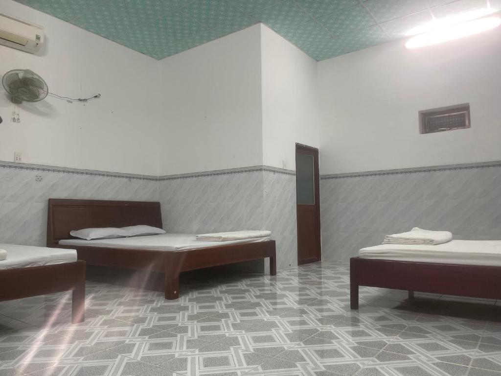 Postel nebo postele na pokoji v ubytování Hotel Gia Hân