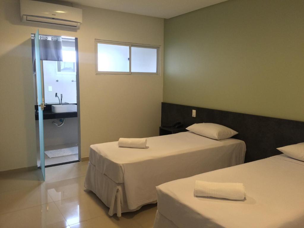 Cama ou camas em um quarto em Scenarium Hotel