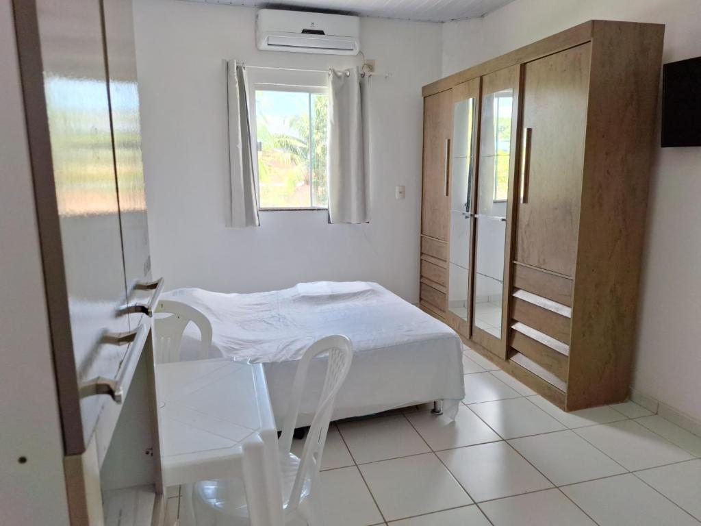 Postel nebo postele na pokoji v ubytování Residencial Dom Fernando