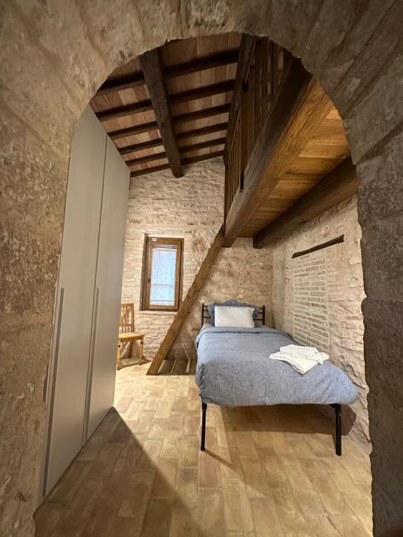 Postel nebo postele na pokoji v ubytování Spello Sant'Onofrio