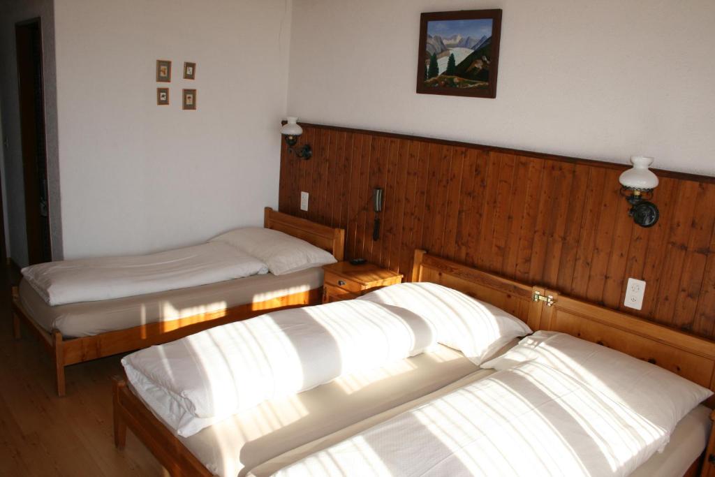 Postel nebo postele na pokoji v ubytování Hotel Fiescherhof