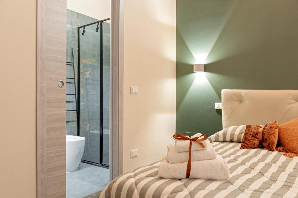 Postel nebo postele na pokoji v ubytování Torretta10 - Casa Vacanze a Livorno