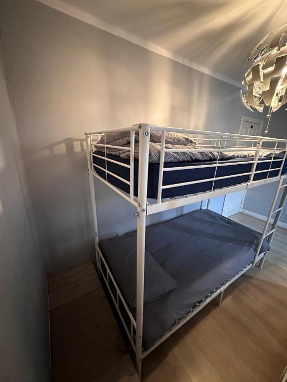 two bunk beds in a room with a ceiling at ROOM Airport in Dublin