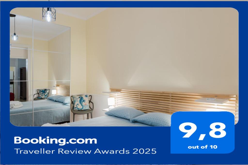 a bedroom with a bed and a mirror at Casetta Fardella 95 in Trapani