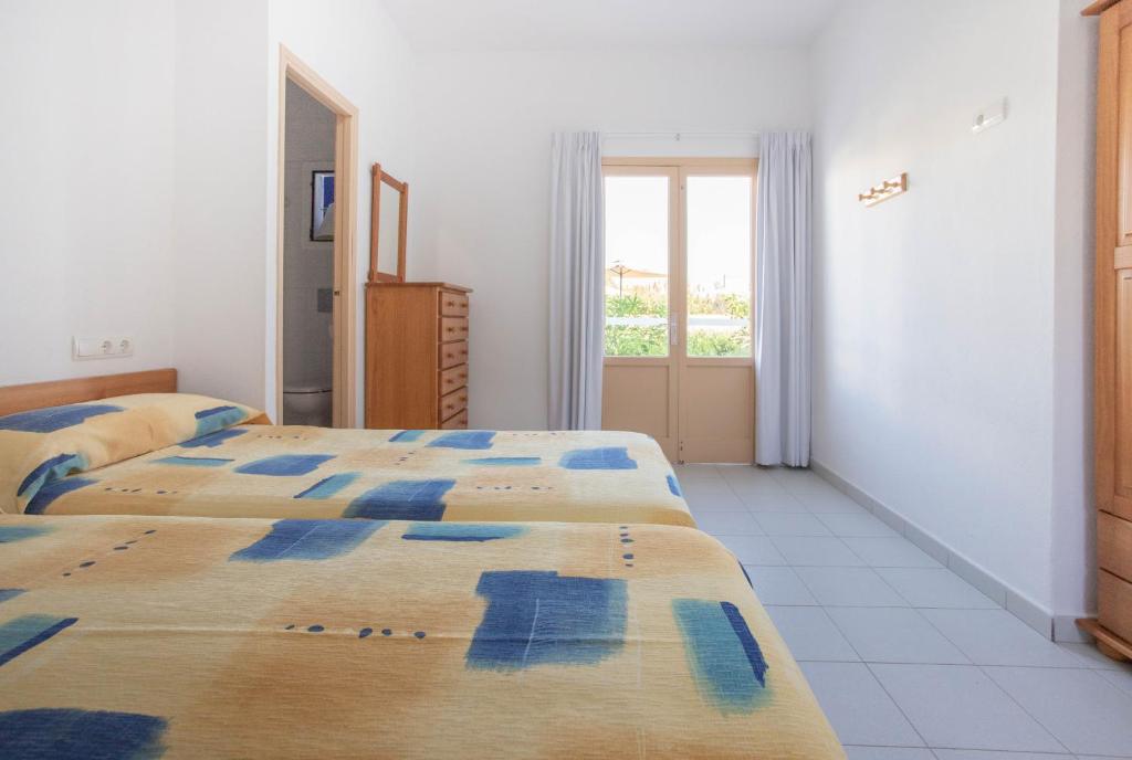 Postel nebo postele na pokoji v ubytování Hostal Mayans