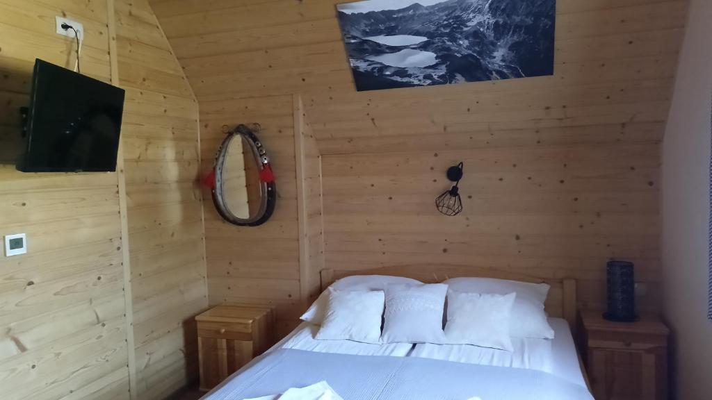 Posteľ alebo postele v izbe v ubytovaní Domek Lilijka