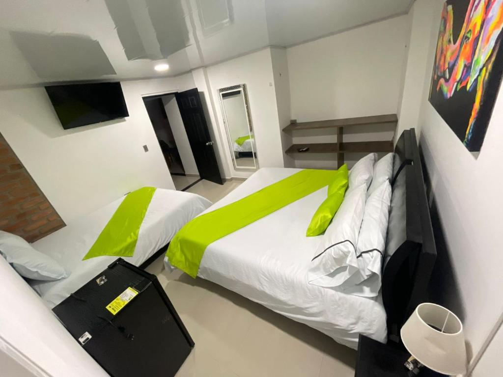 Postel nebo postele na pokoji v ubytování HOTEL LIGHT PLAZA