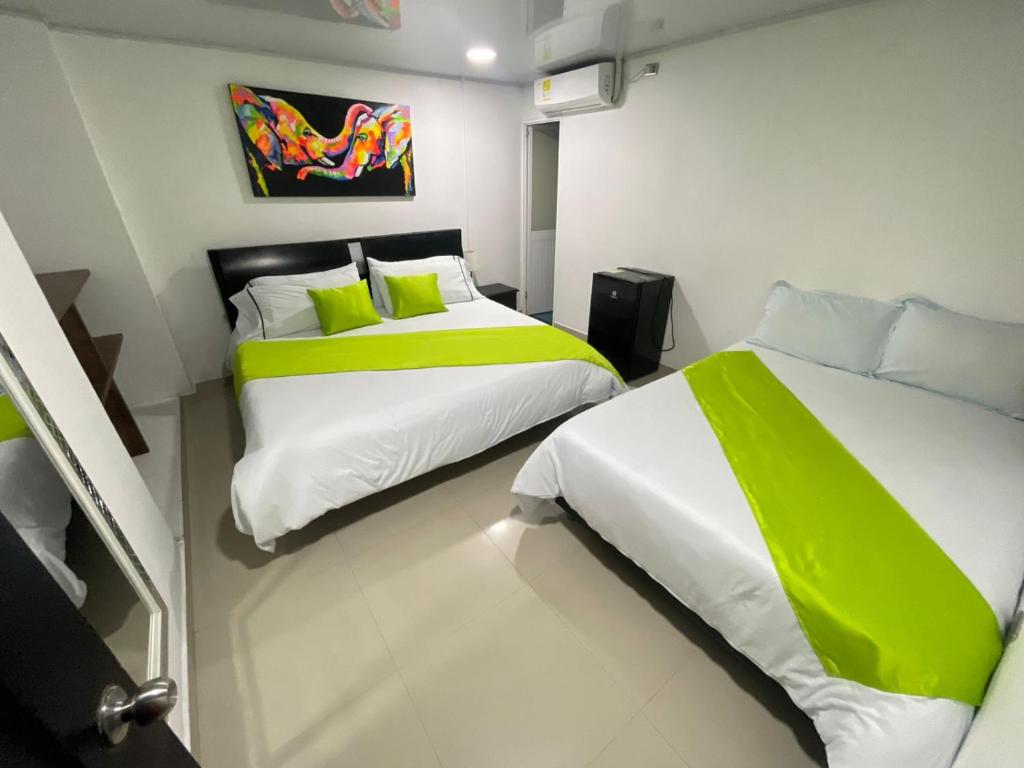 Postel nebo postele na pokoji v ubytování HOTEL LIGHT PLAZA