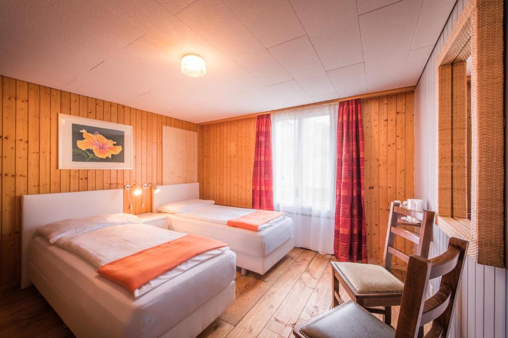 Letto o letti in una camera di Hotel Tell and Apartments