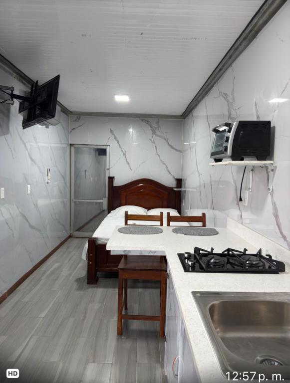 a kitchen with a stove and a counter top at Apartamento doña Lety in Fortuna