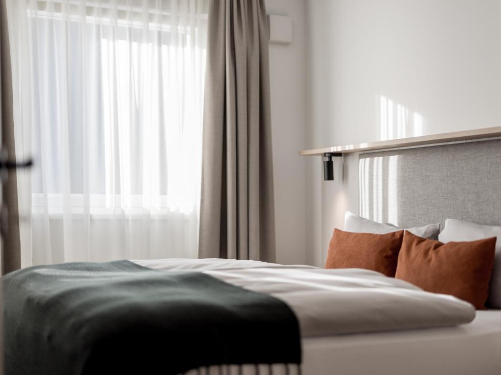 Postel nebo postele na pokoji v ubytování Aparthotel Tante Trude