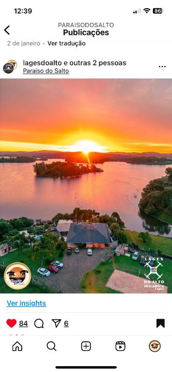 a screenshot of a photo of a sunset over a lake at Paraíso do Salto in Lages