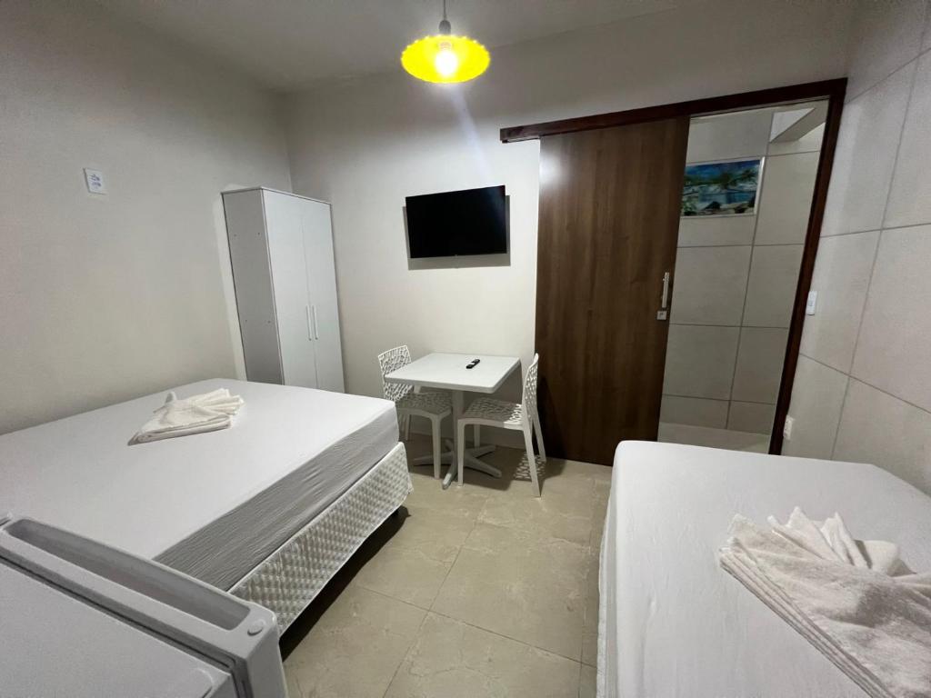 Postel nebo postele na pokoji v ubytování Pousada Nossa Senhora L A L