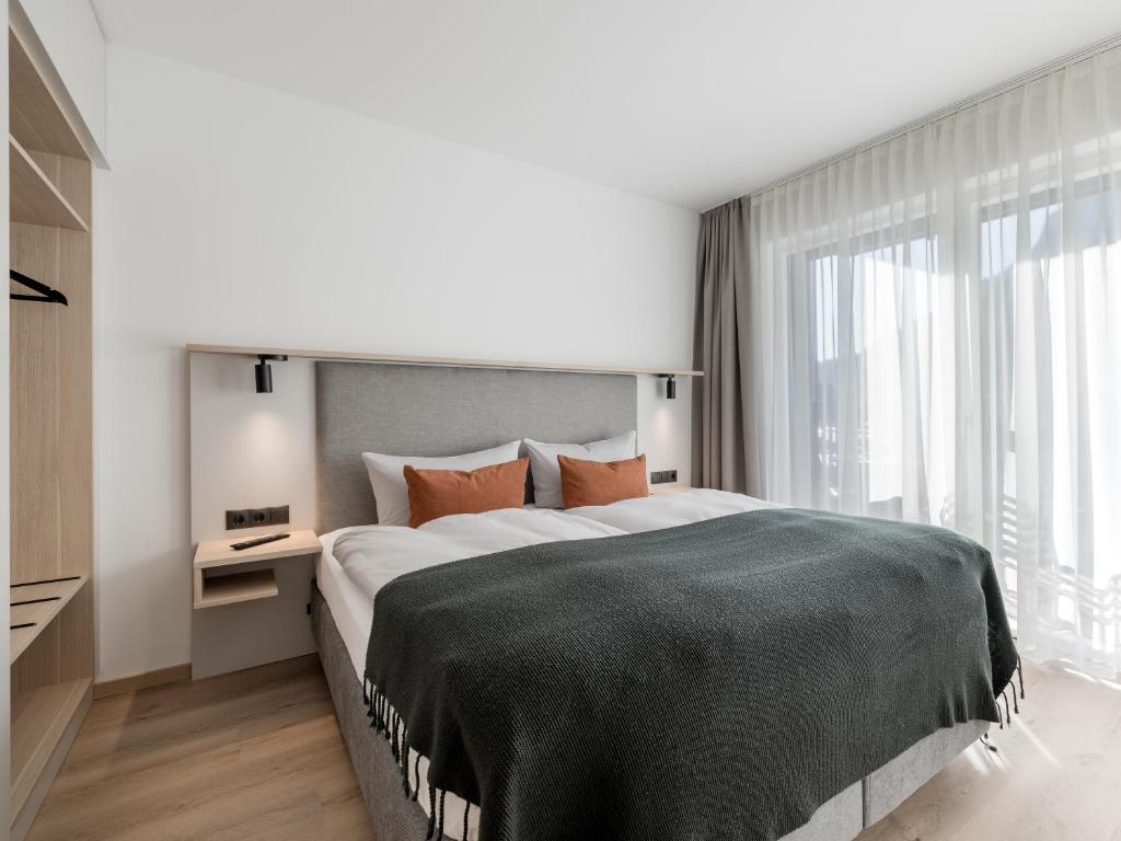 Postel nebo postele na pokoji v ubytování Aparthotel Tante Trude