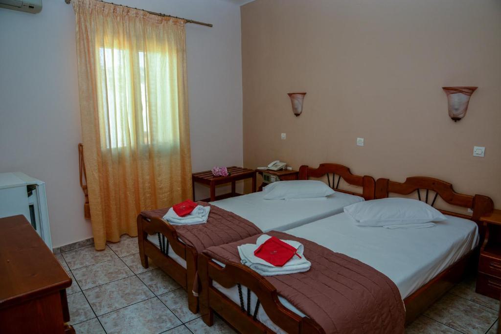 Postel nebo postele na pokoji v ubytování Poseidonio Hotel