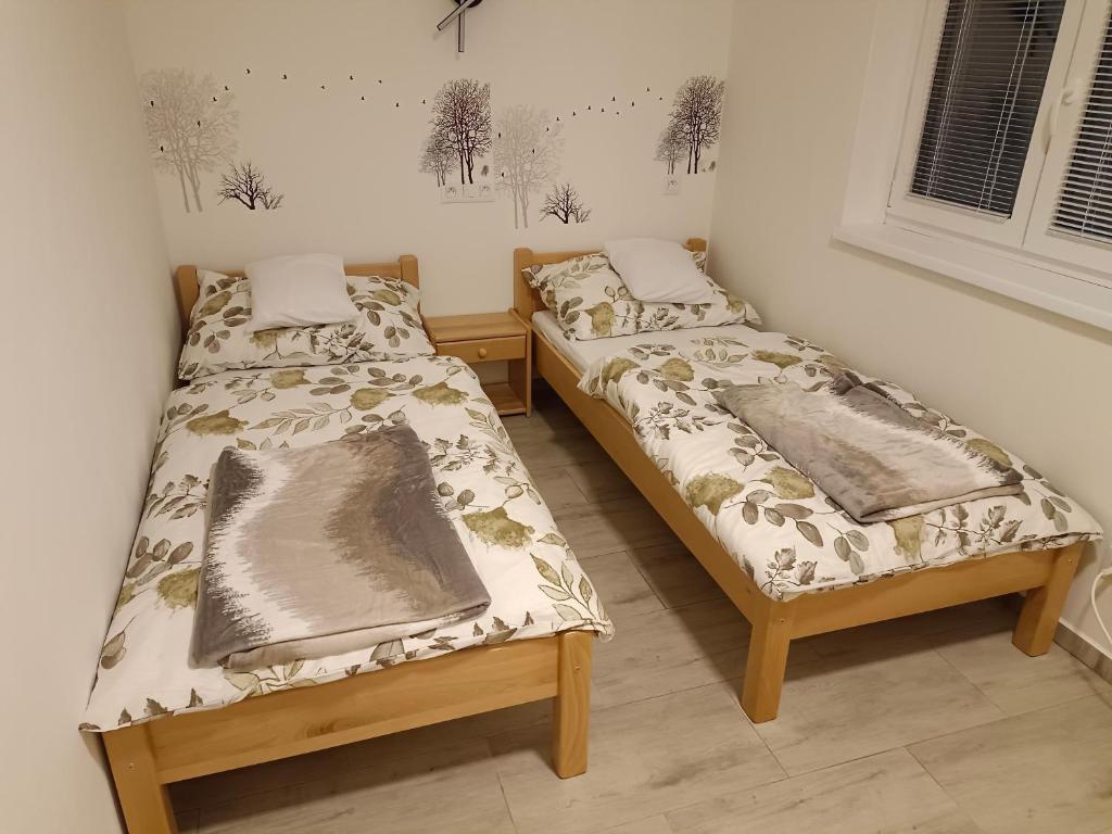 Postel nebo postele na pokoji v ubytování Apartmány Ořechovka Wellness