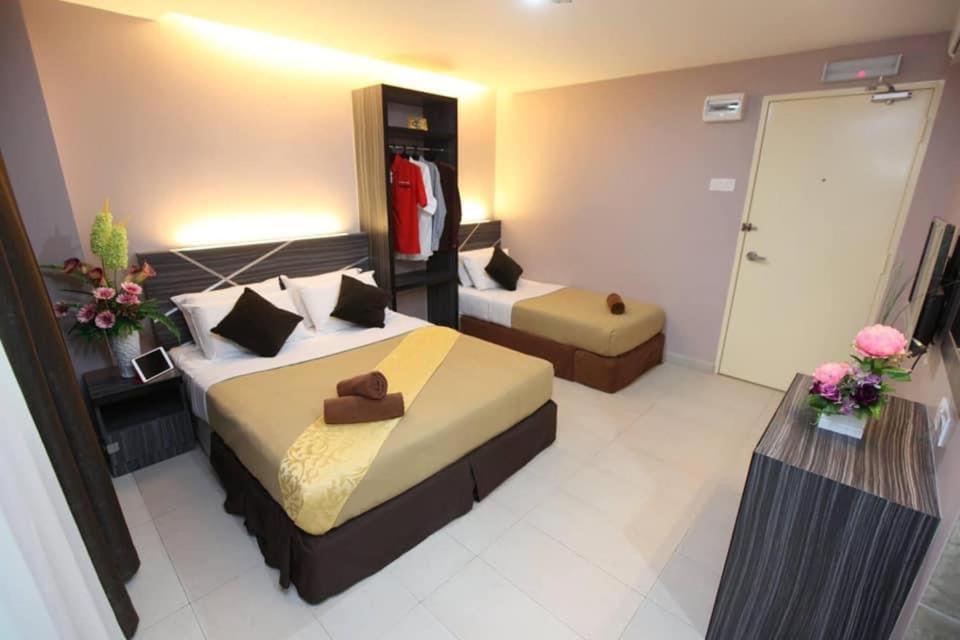 Postel nebo postele na pokoji v ubytování Hotel Dream Nur
