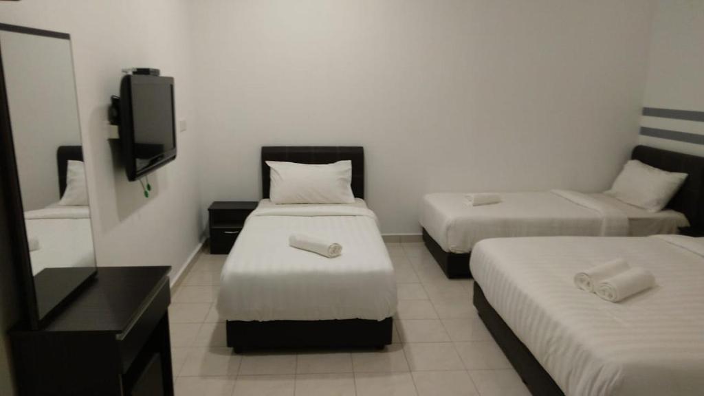 Postel nebo postele na pokoji v ubytování Hotel Dream Nur