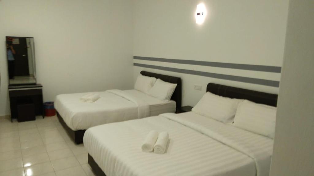 Postel nebo postele na pokoji v ubytování Hotel Dream Nur