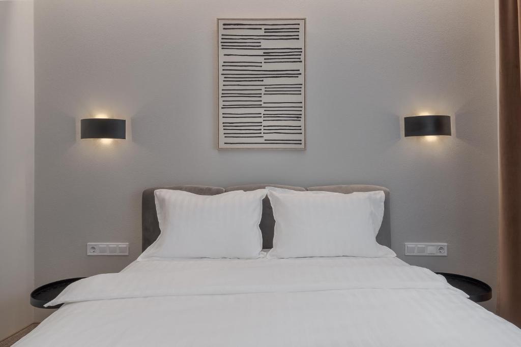 Postel nebo postele na pokoji v ubytování Oasis Rooms