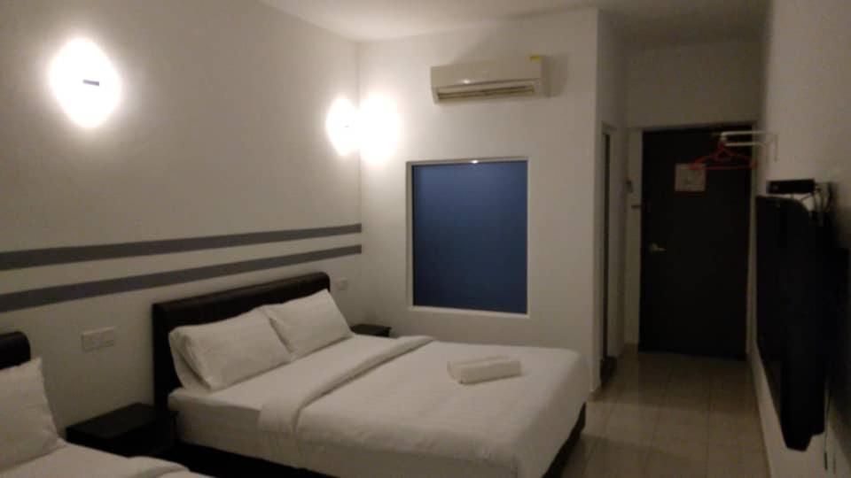 Postel nebo postele na pokoji v ubytování Hotel Dream Nur