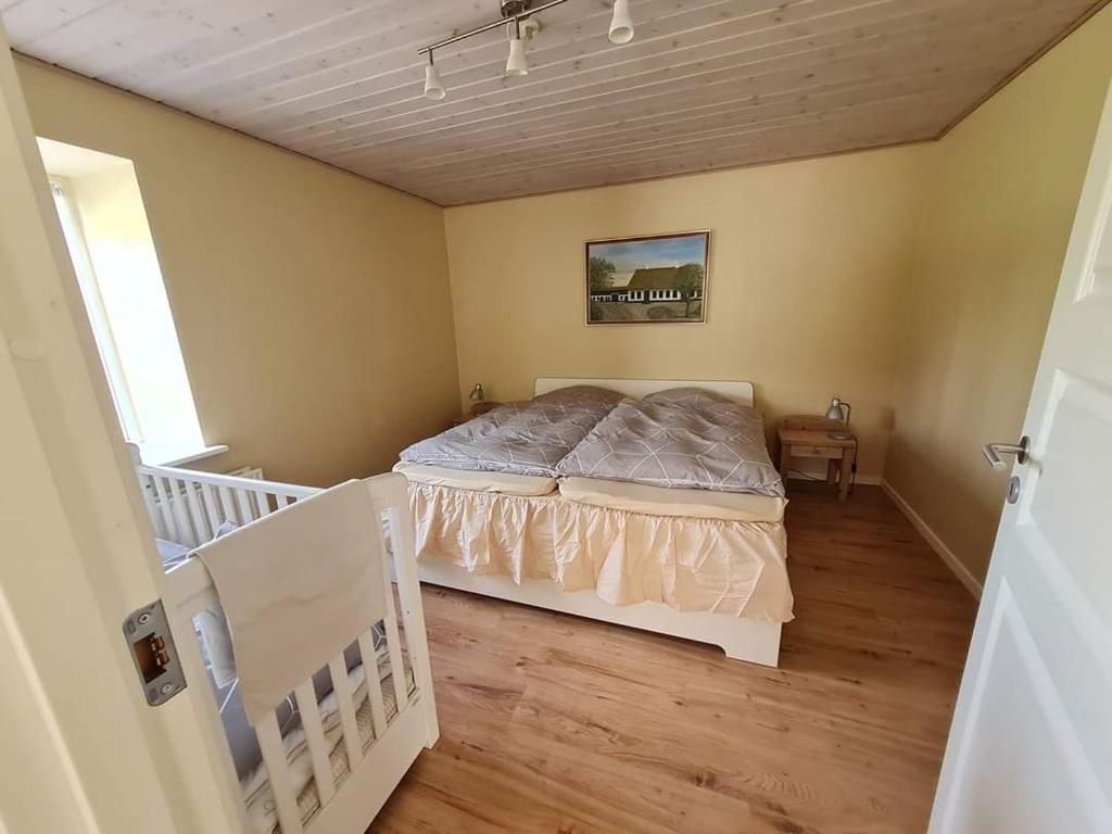 Postel nebo postele na pokoji v ubytování Postgaarden Frøslev