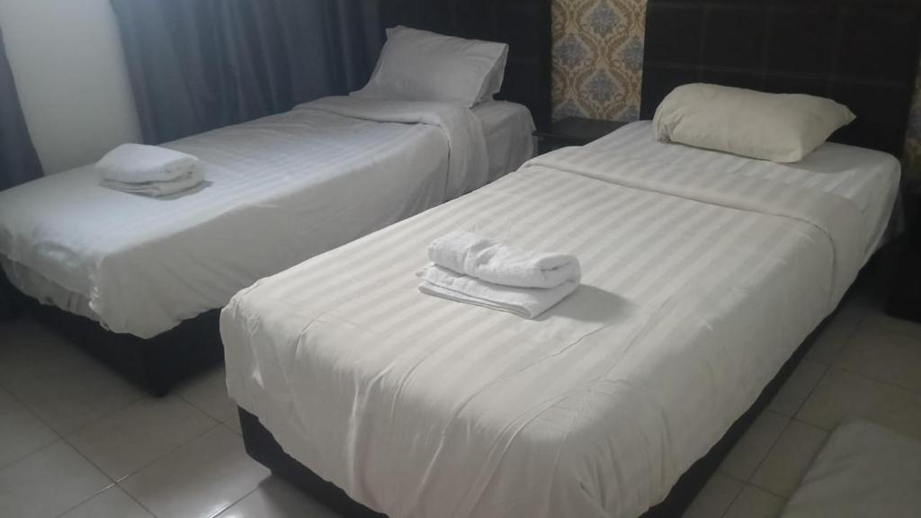 Postel nebo postele na pokoji v ubytování Hotel Dream Nur