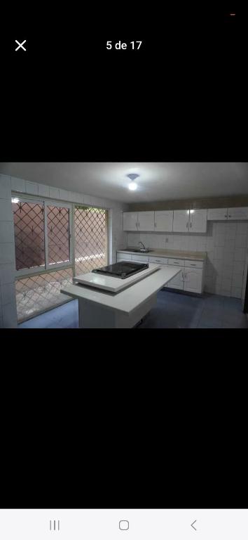 a picture of a kitchen with a stove top at Casa country in Guadalajara
