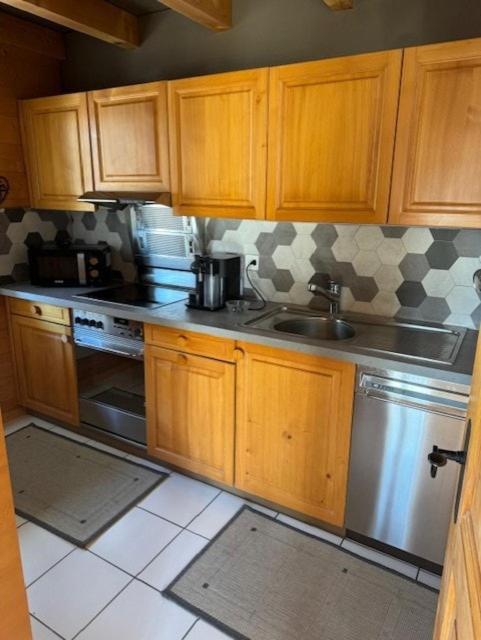 Kuchyň nebo kuchyňský kout v ubytování Chalet cosy avec vue sublime