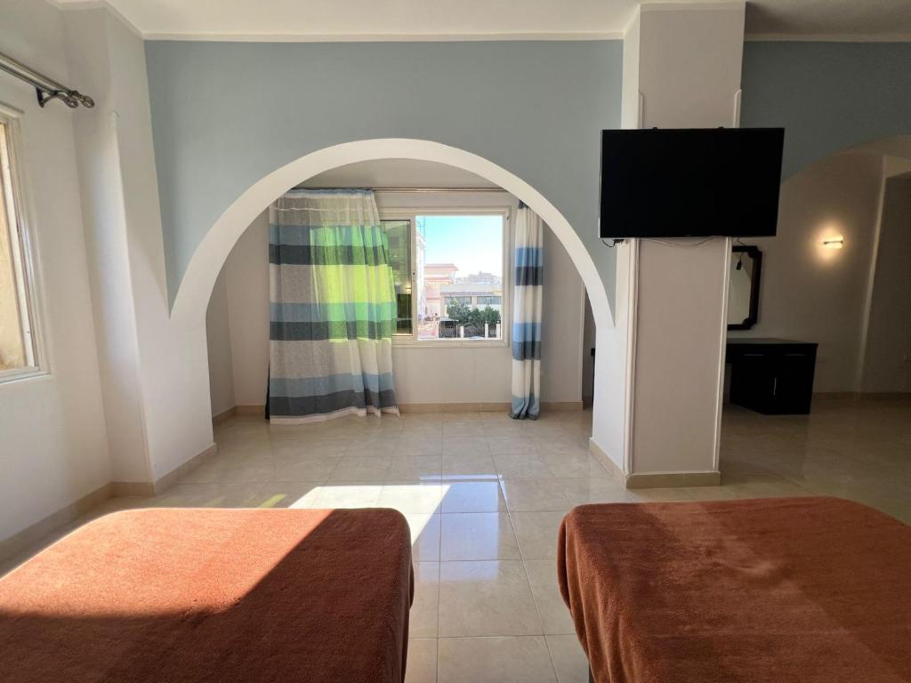 Postel nebo postele na pokoji v ubytování Hurghada Sea Apartments