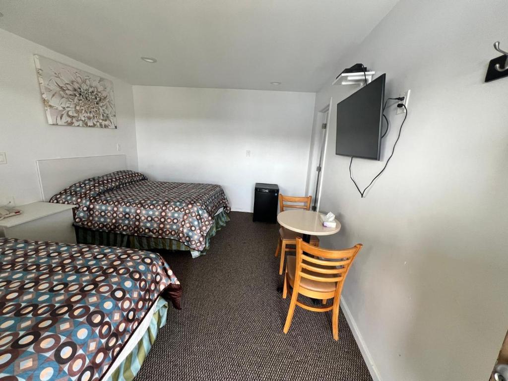 Postel nebo postele na pokoji v ubytování Winslow Motel