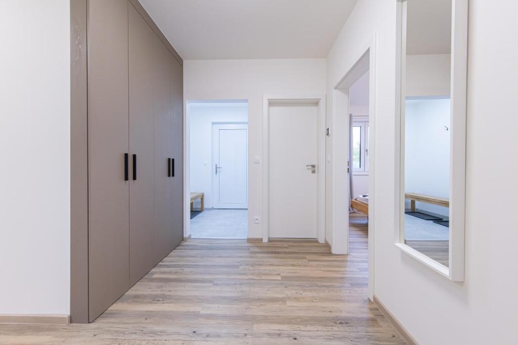 Postel nebo postele na pokoji v ubytování Apartmány u Josífka Velké Losiny