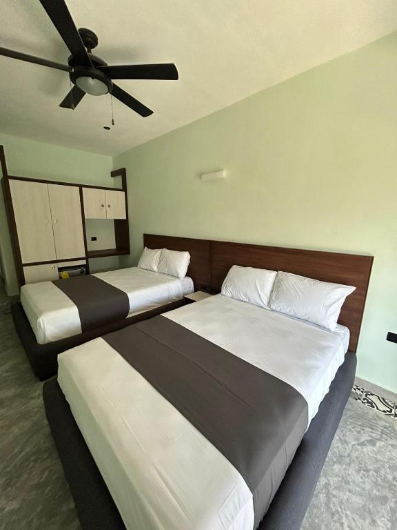 Postel nebo postele na pokoji v ubytování Hotel Mariel Holbox