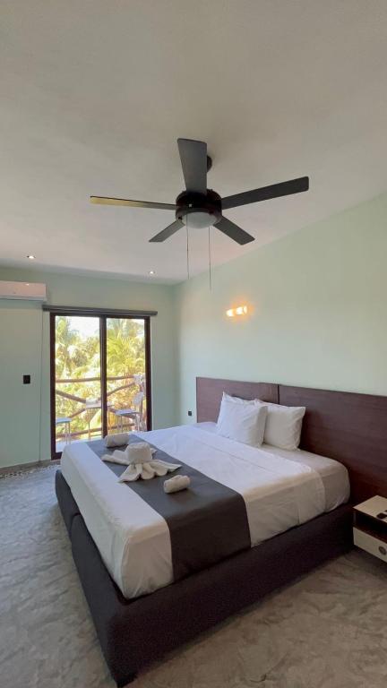 Postel nebo postele na pokoji v ubytování Hotel Mariel Holbox