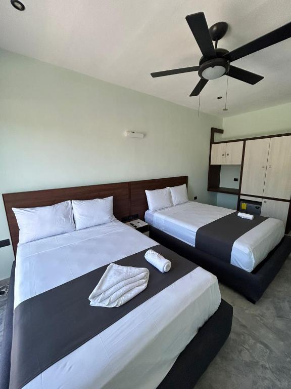 Postel nebo postele na pokoji v ubytování Hotel Mariel Holbox
