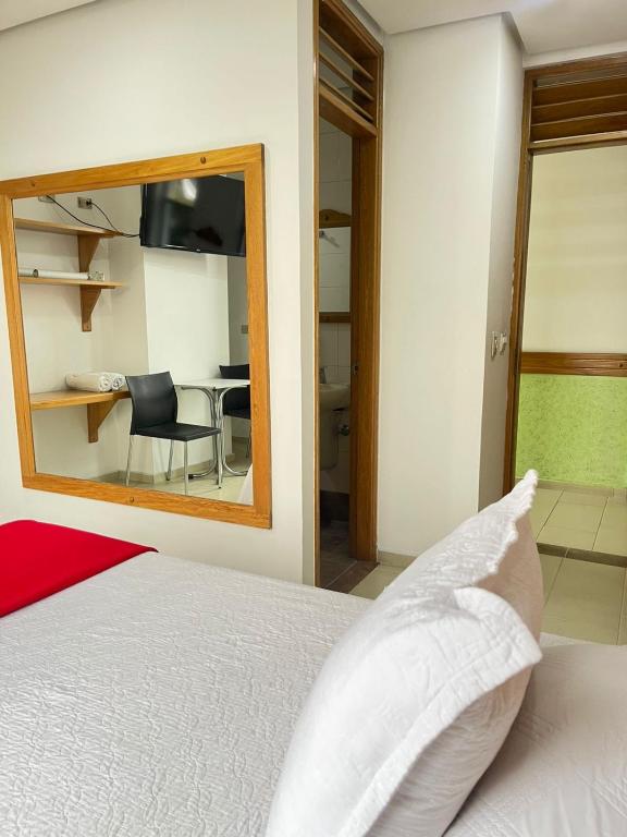 Postel nebo postele na pokoji v ubytování Hotel Portal Central