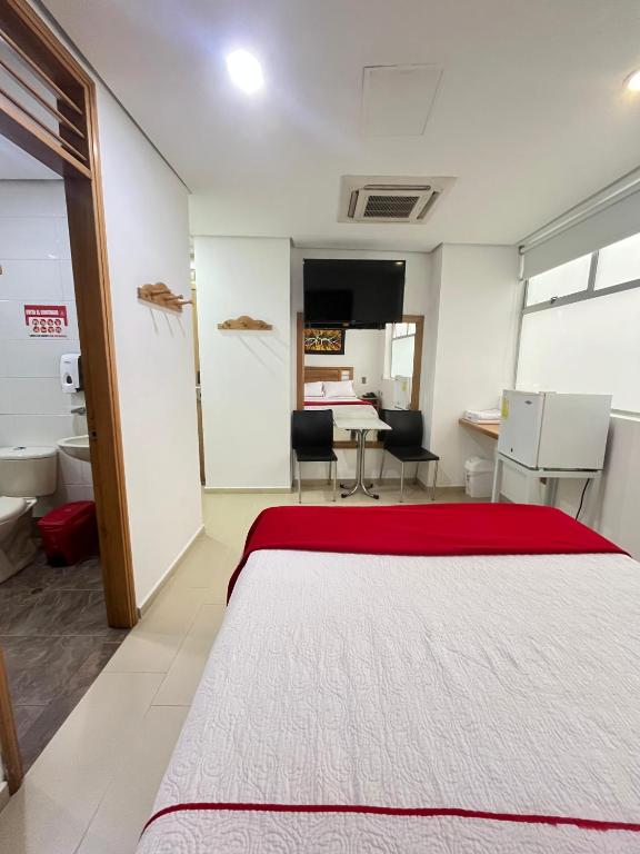 Postel nebo postele na pokoji v ubytování Hotel Portal Central