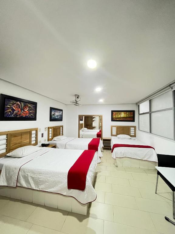 Postel nebo postele na pokoji v ubytování Hotel Portal Central