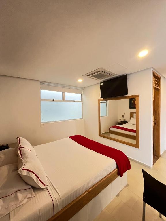 Postel nebo postele na pokoji v ubytování Hotel Portal Central