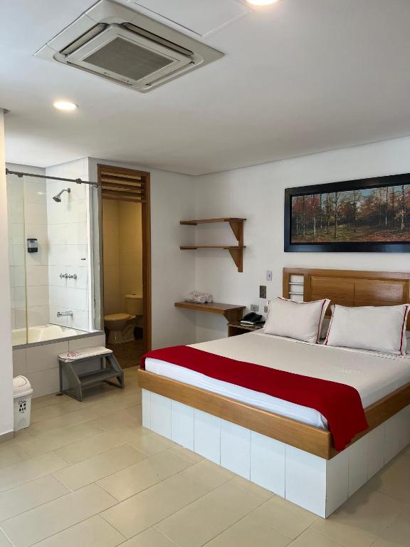 Postel nebo postele na pokoji v ubytování Hotel Portal Central
