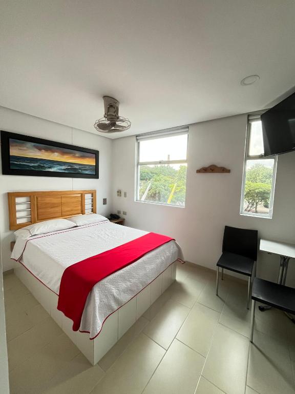 Postel nebo postele na pokoji v ubytování Hotel Portal Central