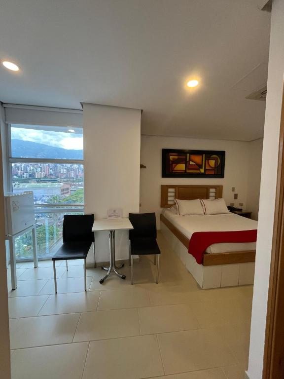 Postel nebo postele na pokoji v ubytování Hotel Portal Central